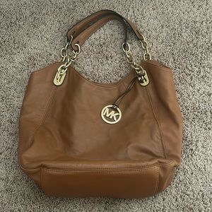 Brown leather Michael Kors Purse with gold accents, lightly used